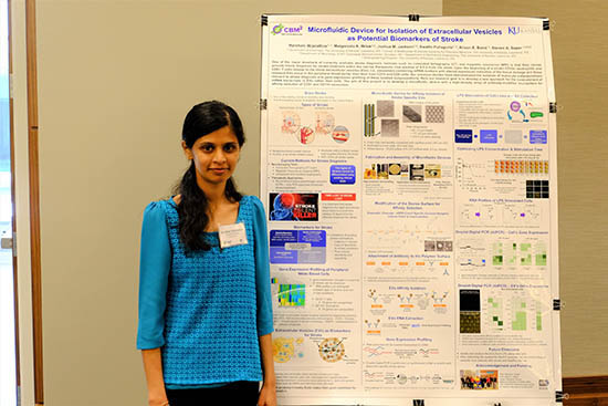 Harshani Wijerathne, graduate student in the Soper group, standing by a research poster.