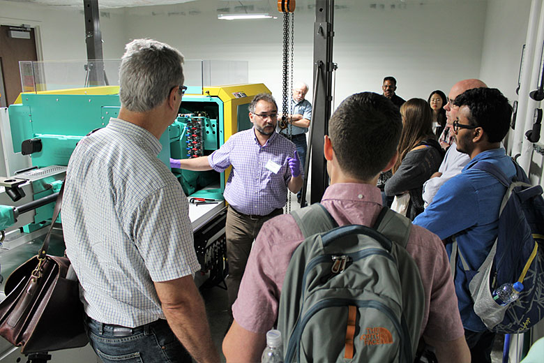 Dr. Matt Hupert explains how the Arburg Allrounder injection molding machine works to the workshop participants