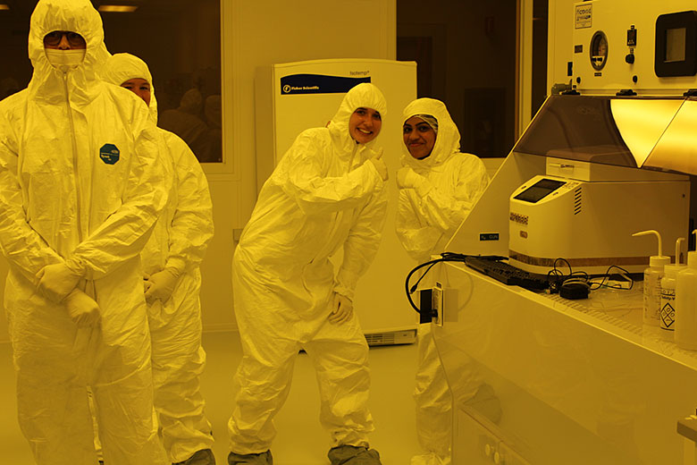 Renee and Swarnagowri give the clean room a big thumbs up