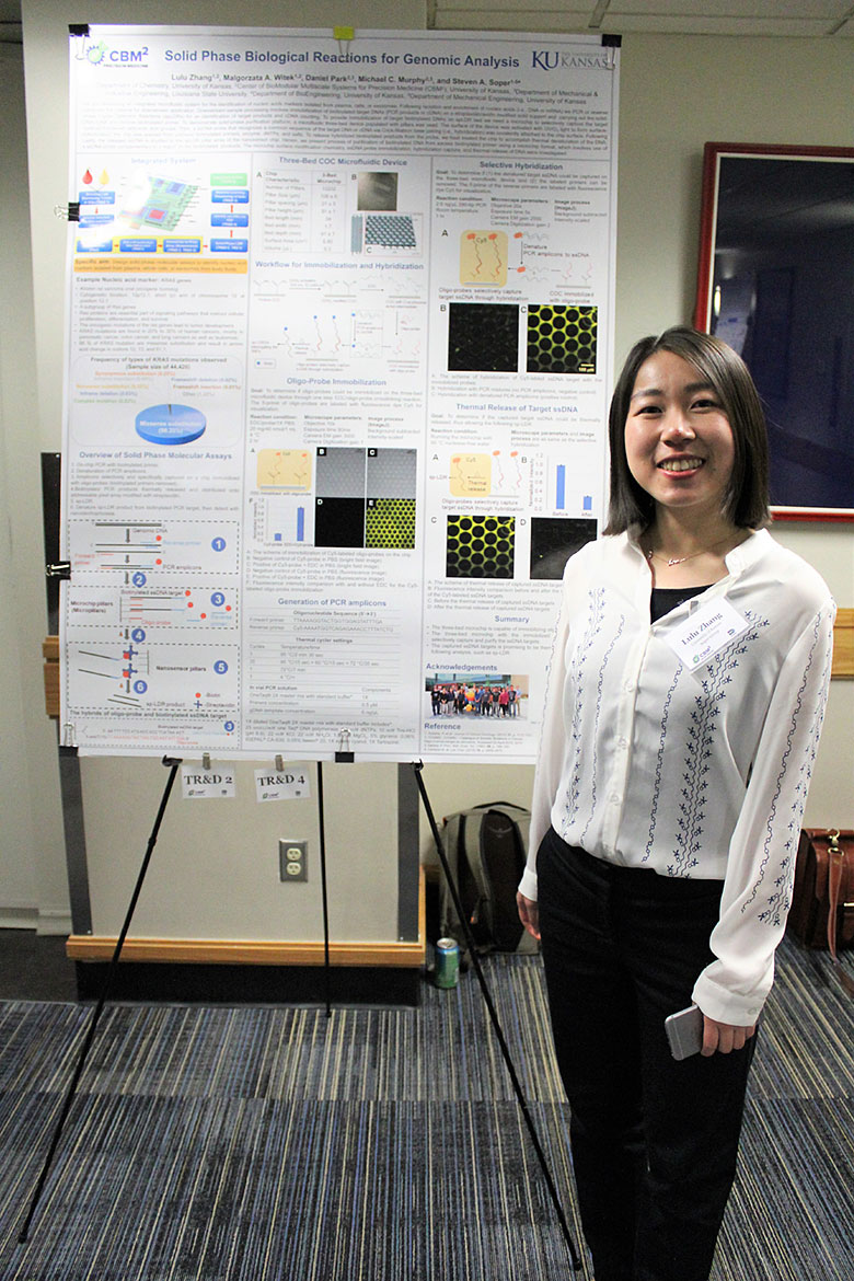 Dr. Lulu Zhang with her poster on solid phase biological reactions