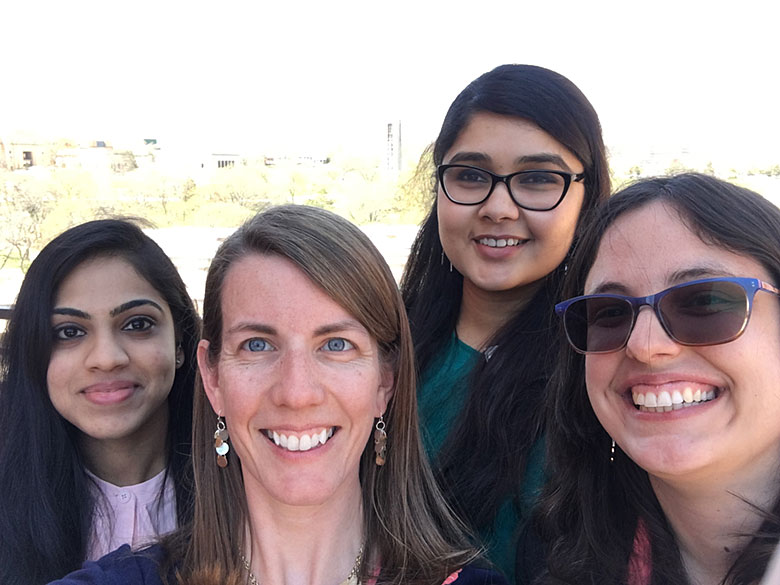 From left: Swarnagowri Vaidyanathan, Center administrative assistant Lindsey Roe, Kavya Dathathreya, and Jenny Conner enjoy a rooftop break during the meeting.