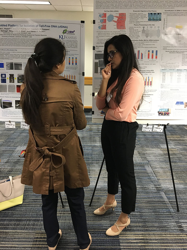 Dr. Mengjia Hu (left) and Sachindra Thippalagamage (right) think about their project