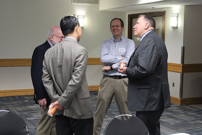 External Advisory Board member Dr. Bruce Gale (center) laughs with members of CBM2 faculty Drs. David Kaufman, Sunggook Park, and Michael Murphy
