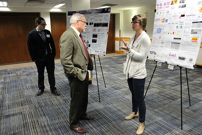 Graduate student Virginia Brown discusses her research with Dr. Steven Soper
