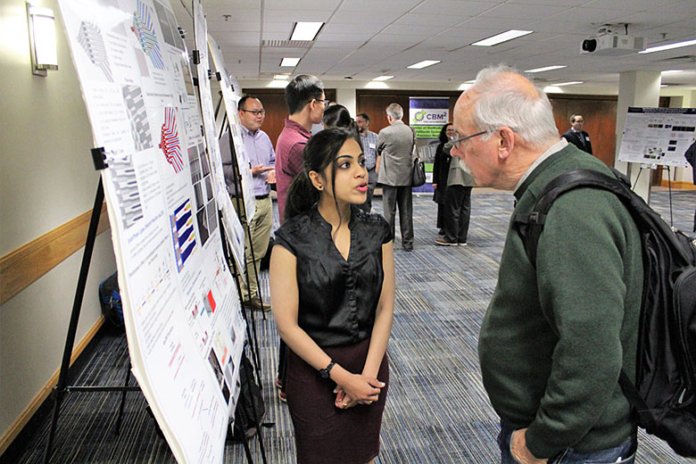 Graduate student Swarnagowri Vaidyanathan presents her research to EAB member Dr. Bill Efcavitch