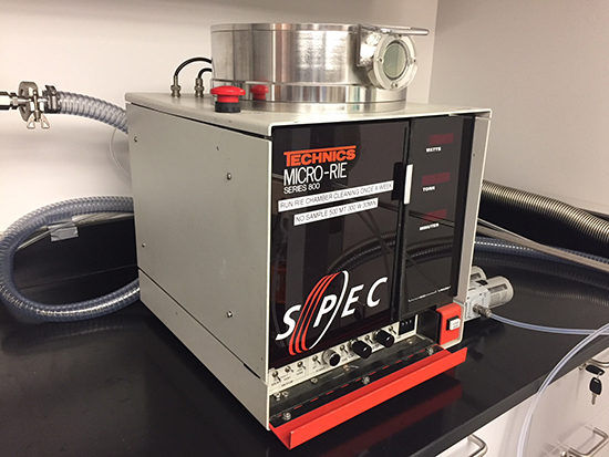 A Reactive Ion Etching (RIE) machine, used for precise etching of materials in microfabrication processes.