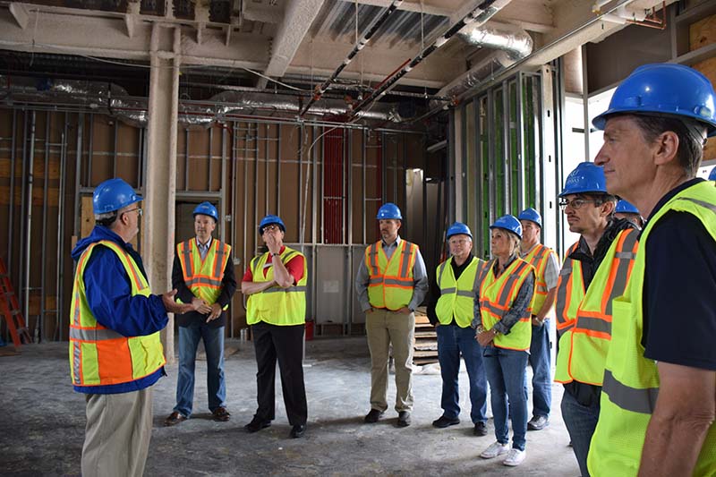 Steve and Shauna Soper (5th and 6th from left) tour the new Integrated Science Building