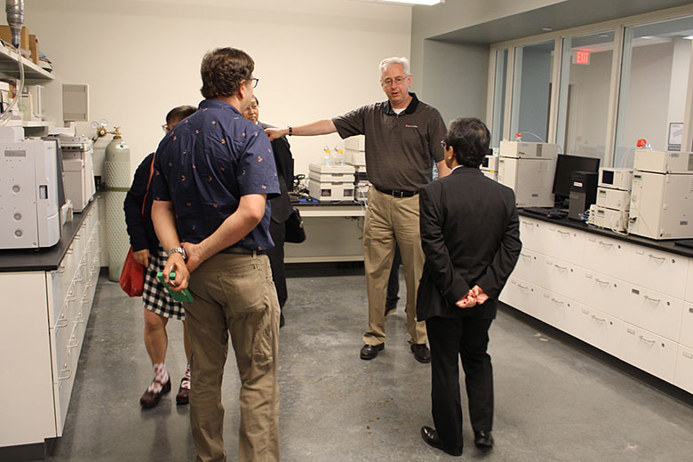 Greg Feldman, Shimadzu Sales Engineer for Kansas, tells Dr. Ueda about the Shimadzu instruments being used by KU's teaching labs