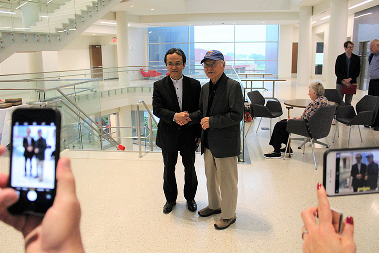 Dr. Ueda greets his mentor, Dr. Ted Kuwana