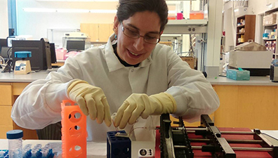 A scientist working with liquid biopsy markers